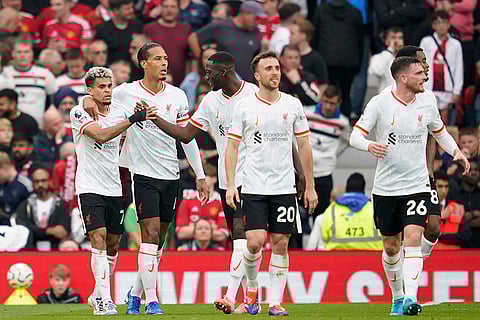 English Premier League 2024-25 Liverpool vs Manchester United: Liverpool's Luis Diaz, left, celebrates with teammates after scoring